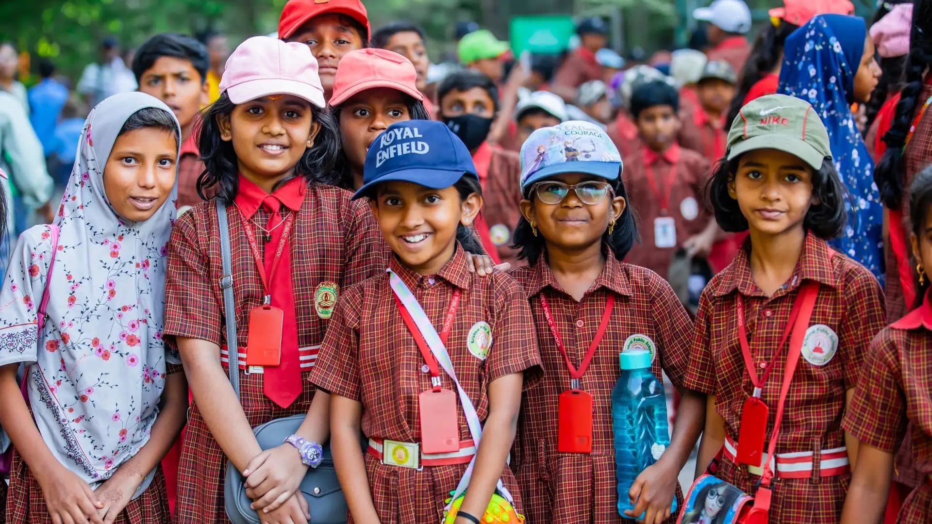 Schoolchildren in uniform smiling together
